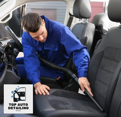 vacuuming seats as part of an interior car detail service